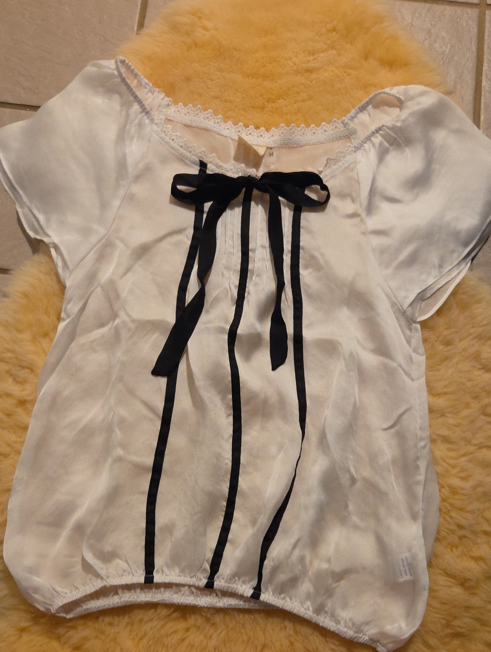 Blush White Short-Sleeve Girls' Top with Black Ribbon Trim